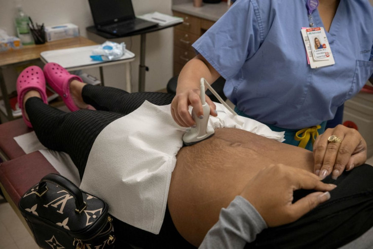 A doctor does an ultrasound on a patient from Austin, Texas, before her surgical abortion at Trust Women clinic in Oklahoma City, U.S., December 6, 2021. Picture taken December 6, 2021. 