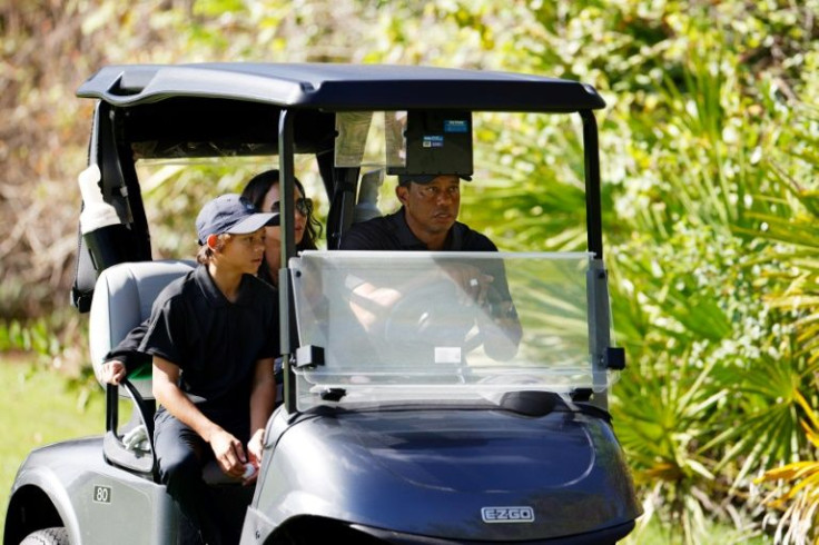 Tiger Woods, at right beside son Charlie with girlfriend Erica Herman in the back seat, had a golf cart to help him around the course during December's PNC Championship in Orlando, Florida