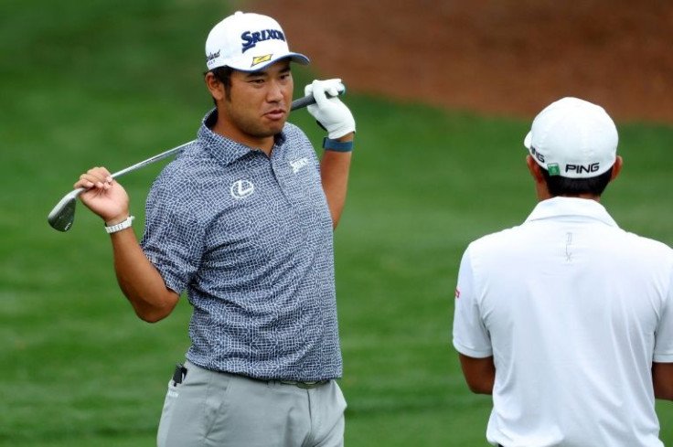 Fitness battle: Defending champion Hideki Matsuyma of Japan stretches out his sore neck during a practice round prior to the Masters at Augusta National