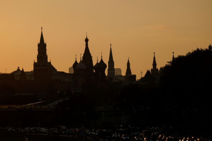 St. Basil's Cathedral and towers of Kremlin are silhouetted against the sunset in Moscow, Russia August 12, 2021.  