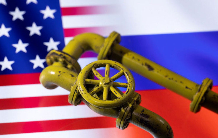 3D printed Natural Gas Pipes are placed on displayed U.S. and Russian flags in this illustration taken, January 31, 2022. 