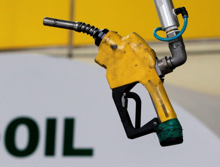 A gas pump is seen hanging from the ceiling at a petrol station in Seoul June 27, 2011. 