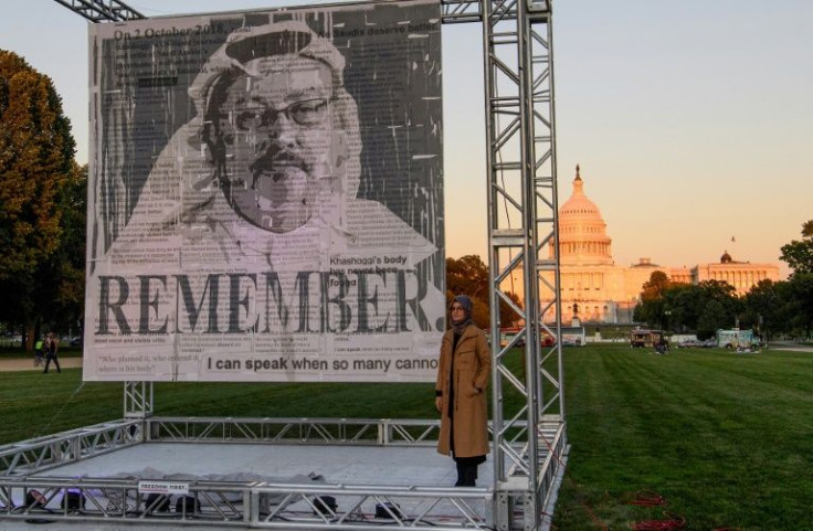 Turkish writer Hatice Cengiz (R), fiancee of murdered Saudi journalist and dissident Jamal Khashoggi, posing next to a portrait of him in Washington