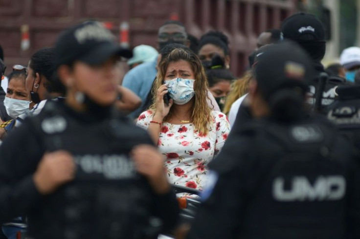 A relative of an inmate cries as she waits for news about her loved one after 58 convicts were killed in a riot at the Guayas 1 prison in Guayaquil, Ecuador, on November 13, 2021