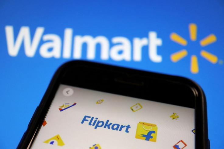 A mobile phone showing an image of Indian online retailer Flipkart is seen in front of a Walmart Inc logo displayed in this illustration picture taken July 14, 2021.
