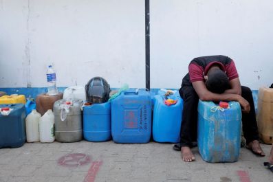 A man rests while waiting in a line to buy diesel near a Ceylon Petroleum Corporation fuel station, amid the country's economic crisis in Colombo, Sri Lanka, April 7, 2022. 