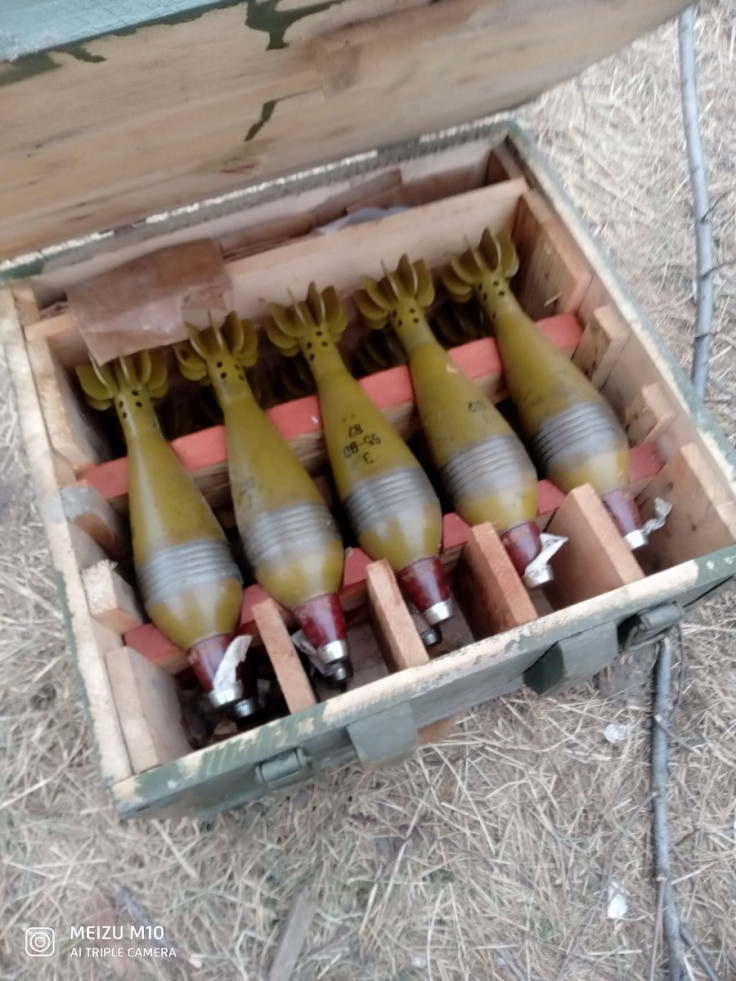 Mortar shells left by Russian troops are pictured near apartment complex on Vodoprovidna Street, amid Russia's invasion of Ukraine, in Bucha, Ukraine, in this undated handout photo obtained by Reuters on April 6, 2022. Oleksii Tarasevich/Handout via REUT