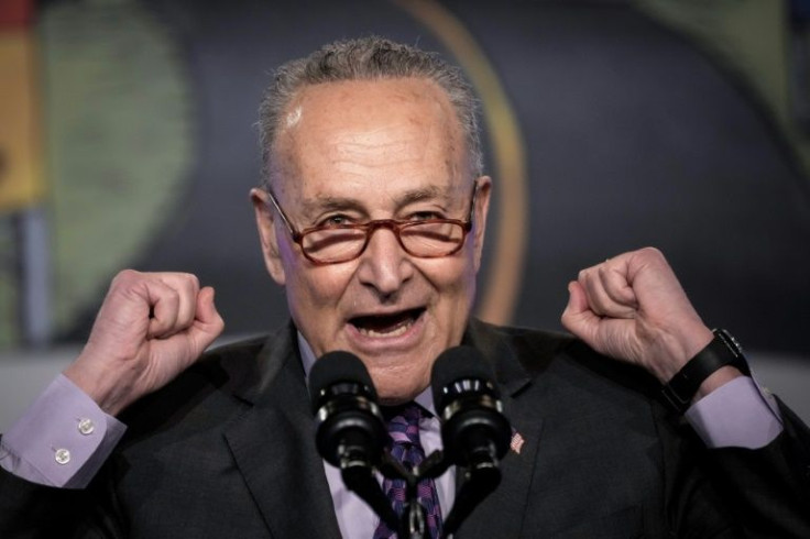 Senate Majority Leader Chuck Schumer, pictured on April 6, 2001, is urging Congress to hold President Vladimir Putin accountable over the violence in Ukraine