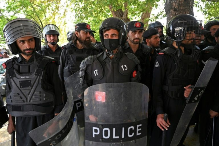 Riot police stand guard at the Supreme Court ahead of the ruling