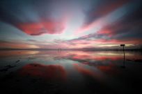 Sunset is reflected in the Salton Sea as seen from Bombay Beach, California, U.S., March 15, 2022. Picture taken March 15, 2022. 