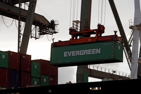 A crane lifts a Evergreen Marine's container at Kaohsiung Port, Taiwan August 7, 2017. 