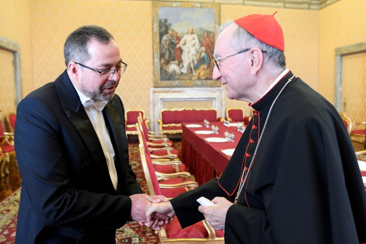 Vatican's Secretary of State, Cardinal Pietro Parolin shakes hand with Ukraine's ambassador to the Vatican, Andriy Yurash during a private audience at the Vatican, April 7, 2022. Vatican Media/Â­Handout via REUTERS    