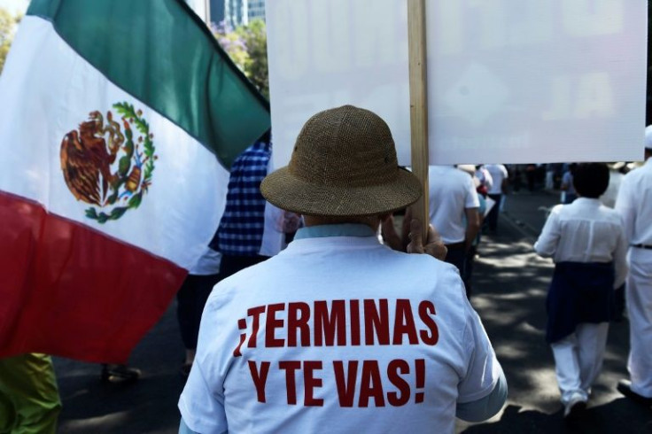 'Finish and go' reads the slogan on a T-shirt worn by a protester at a demonstration against the presidential recall referendum in Mexico City