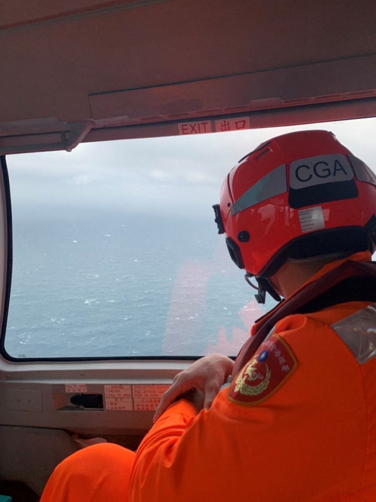 A member of a rescue squad monitors the sea during a search and rescue operation after a ship went missing on its way from the South Korean city of Busan to Indonesia's Batam port, near the Penghu Islands, in the Taiwan Strait, April 8, 2022. Taiwan Coast