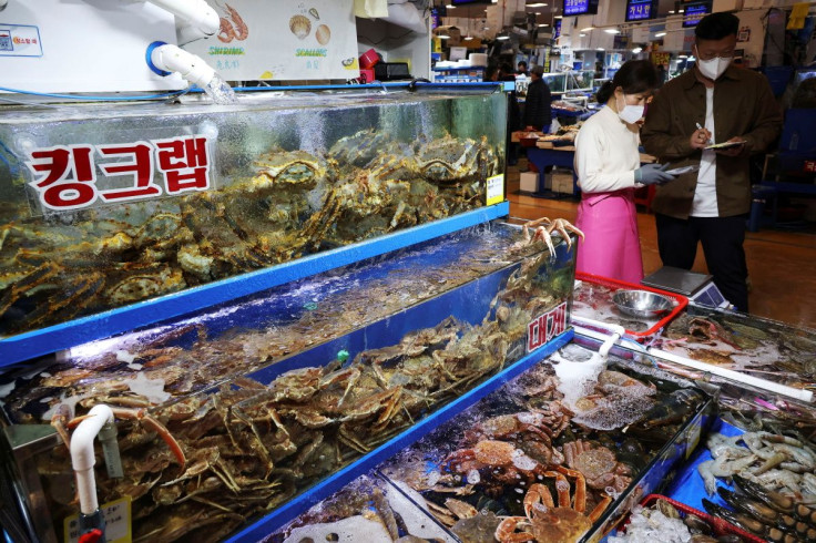 A man shops crabs, imported from Russia, at Noryangjin Fisheries Wholesale Market in Seoul, South Korea, April 8, 2022.