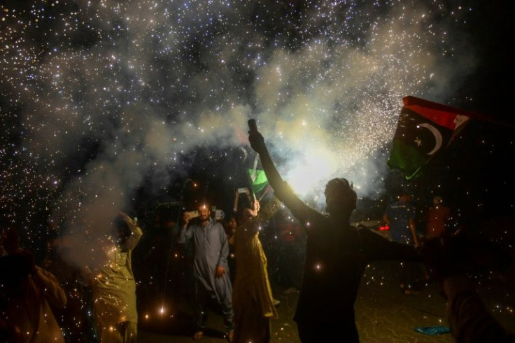 Pakistan Peoples' Party supporters celebrate in Karachi after the supreme court decision
