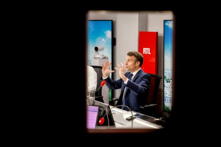 Macron sought Friday to regain the initiative by turning the fire on Le Pen