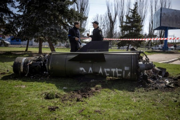 The military-green remains of a rocket lay just next to the building and scrawled with the words 'for our children'