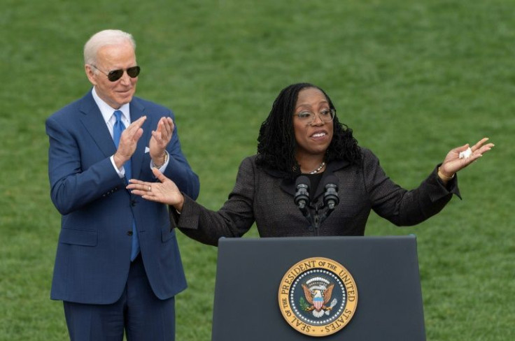 US President Joe Biden applauds as Judge Ketanji Brown Jackson speaks at an event celebrating her confirmation to the US Supreme Court on the South Lawn of the White House in Washington, DC, on April 08, 2022