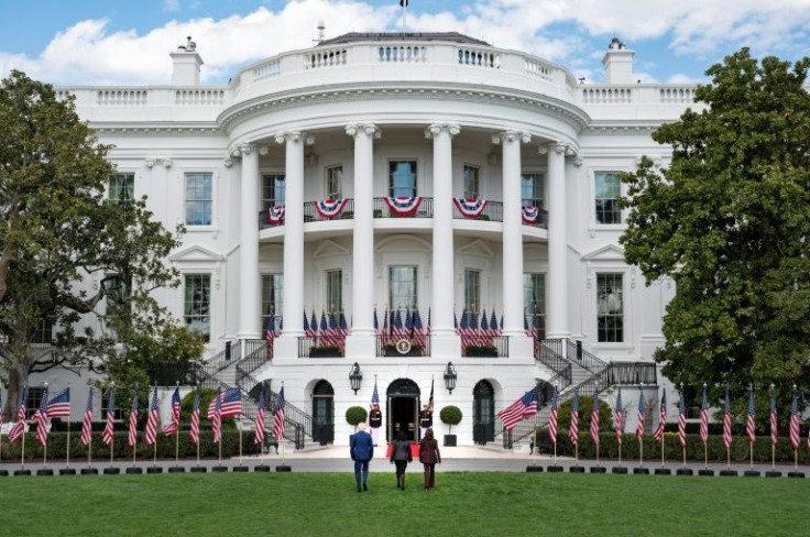 In front of a sun-drenched White House decked in US flags, Joe Biden vowed future generations would be "proud of what we did" in choosing Ketanji Brown Jackson