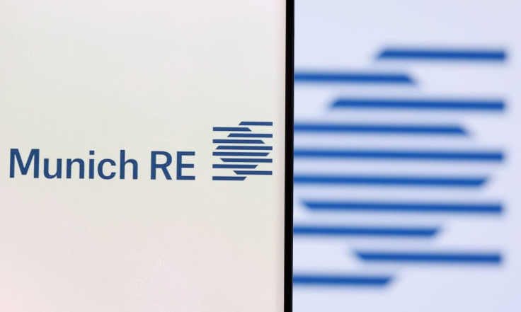 Munich Re Group logo is seen on a smartphone in front of displayed same logo in this illustration taken, December 1, 2021. 