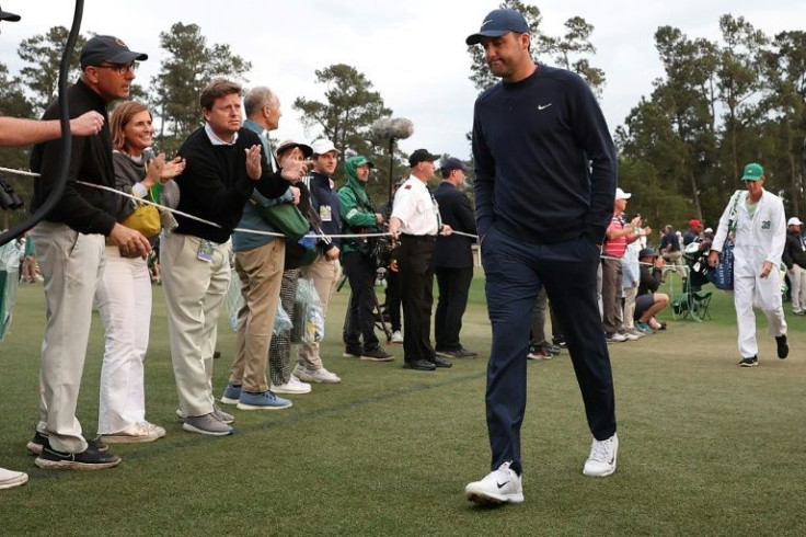 World number one Scottie Scheffler walks off the 18th green after shooting 67 on Friday to seize a five-stroke lead after 36 holes at the Masters
