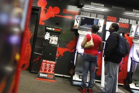 People play video games inside a GameStop retail store in New York March 18, 2010