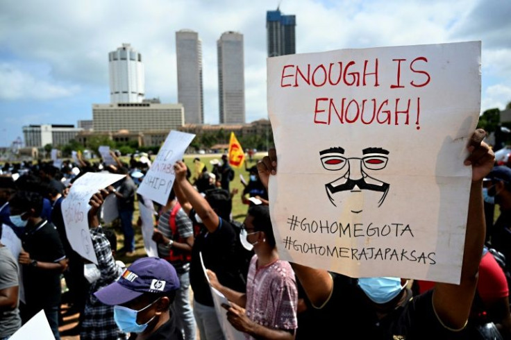 Protesters carried handwritten placards that read 'It's time for you to leave' and 'enough is enough'