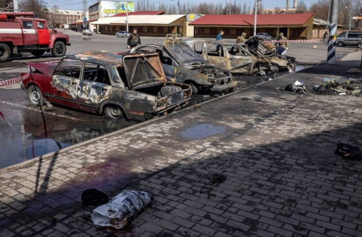 Burned out cars outside the train station in Kramatorsk, as civilian survivors of Friday's deadly rocket attack began to evacuate