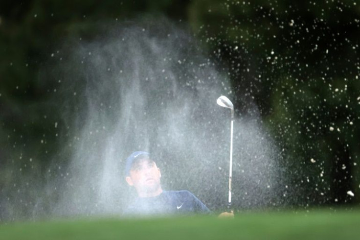 Major opportunity: Scottie Scheffler plays a shot from the bunker at 17 on the way to a five-shot halfway lead at the 86th Masters