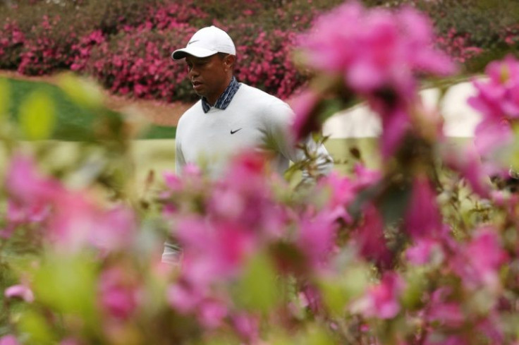 Tiger Woods walks off the 13th green after making a birdie in Saturday's third round of the 86th Masters