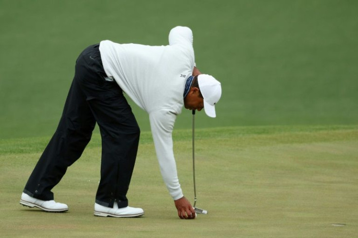Tiger Woods prepares to putt on in the third round of the Masters at Augusta National