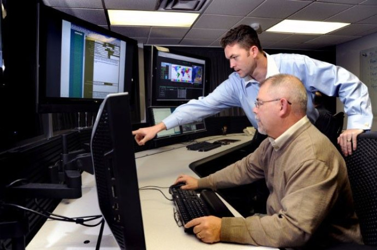 U.S. Department of Homeland Security (DHS) employees work on the Industrial Control Systems Cyber Emergency Response Team (ICS-CERT) operational watch floor at the Idaho National Laboratory in Idaho Falls, Idaho