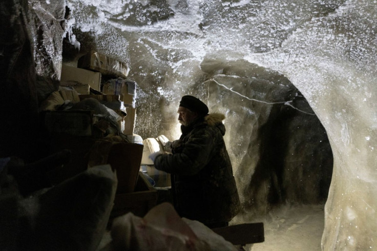 Sergey Zimov, 66, a scientist who works at Russia's Northeast Science Station, checks materials stored underground in the permafrost at the Pleistocene Park outside the town of Chersky, Sakha (Yakutia) Republic, Russia, September 13, 2021. 