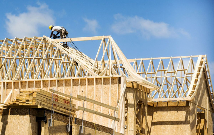 A construction worker works on a new house being built in a suburb located north of Toronto in Vaughan, Canada, June 29, 2015. 