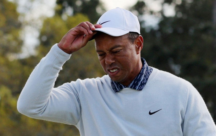 Golf - The Masters - Augusta National Golf Club - Augusta, Georgia, U.S. - April 9, 2022 Tiger Woods of the U.S. acknowledges patrons as he walks onto the 18th green during the third round 