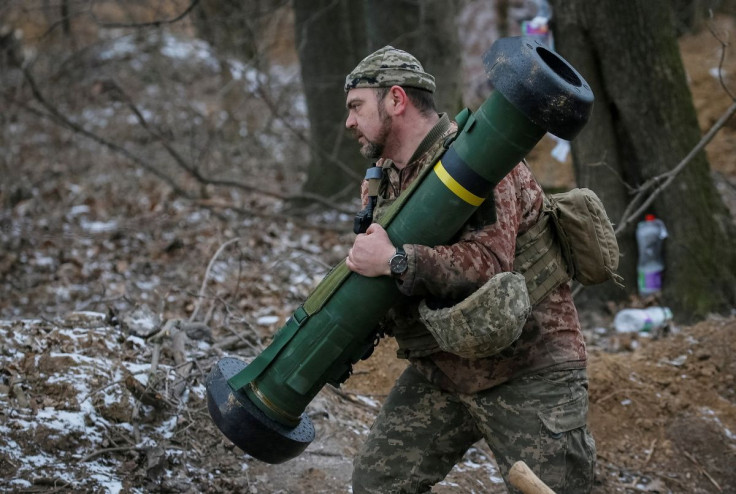 A Ukrainian service member holds a Javelin missile system at a position on the front line in the north Kyiv region, Ukraine March 13, 2022. 
