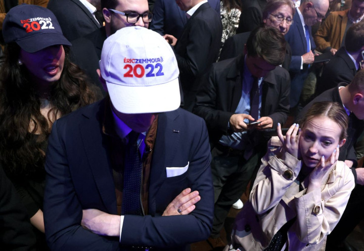 Supporters of the French far-right commentator Eric Zemmour, leader of far-right party "Reconquete!" and candidate for the 2022 French presidential election, react to the election results in the first round of the 2022 French presidential election, in Par