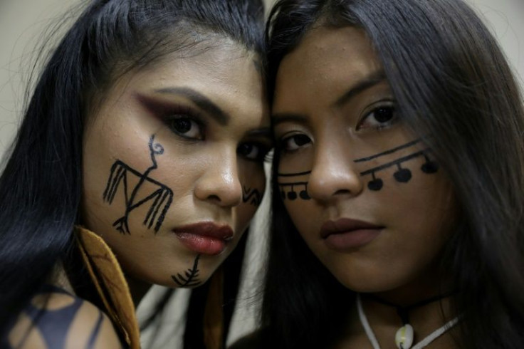 Ira Maragua (L), of the Tikuna tribe and Kim PuremanÃ£, of the  SaterÃ©-MawÃ©, were among 37 models -- women and men -- representing 15 indigenous groups of Brazil, to take part in the month-long fashion extravaganza