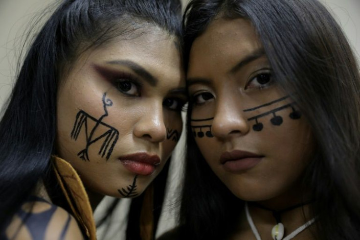 Ira Maragua (L), of the Tikuna tribe and Kim Puremanã, of the Sateré-Mawé, were among 37 models -- women and men -- representing 15 indigenous groups of Brazil, to take part in the month-long fashion extravaganza