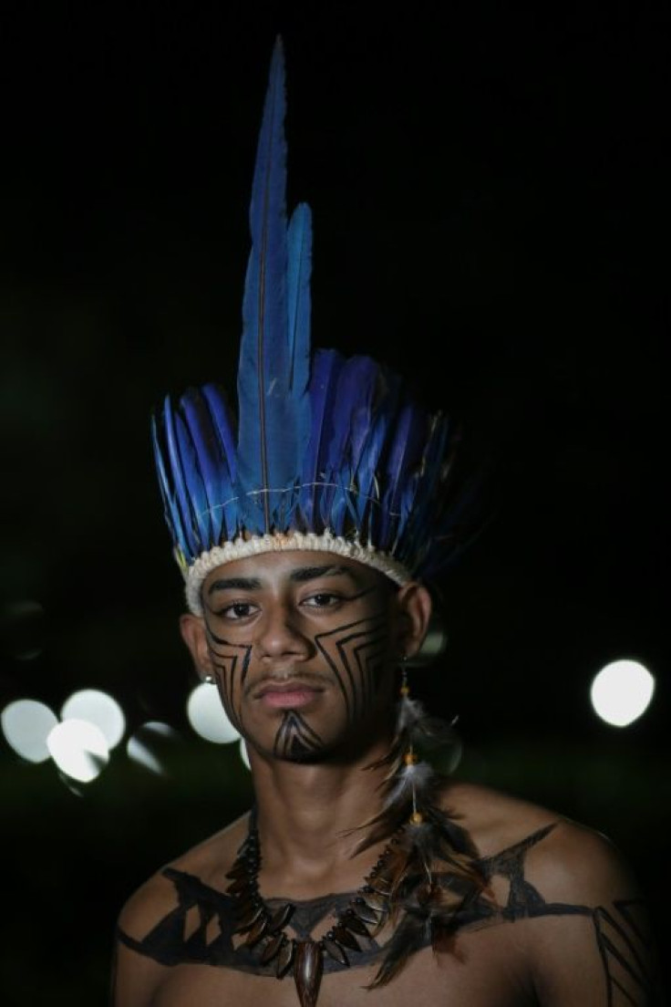 The designers use natural elements in their creations, such as feathers, the spearlike teeth of the pecari -- an Amazonian boar -- the red guarana fruit, acai seeds and coconut shells