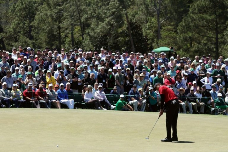 Spotlight: Tiger Woods putts on the ninth green during the final round of the 86th Masters
