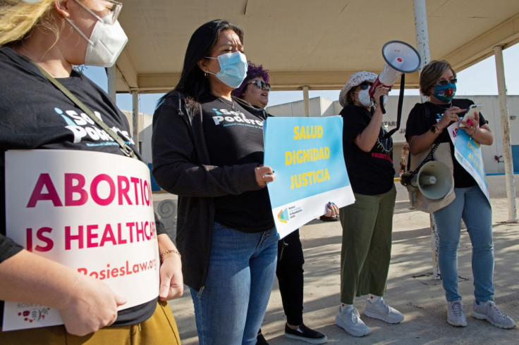 Protesters stand outside the Starr County Jail after Lizelle Herrerra, 26, was charged with murder for allegedly performing what authorities called a "self-induced abortion", in Rio Grande City, Texas, U.S. April 9, 2022.