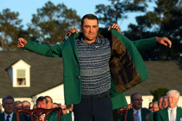 American Scottie Scheffler is awarded the green jacket of the Masters winner by 2021 champion Hideki Matsuyama