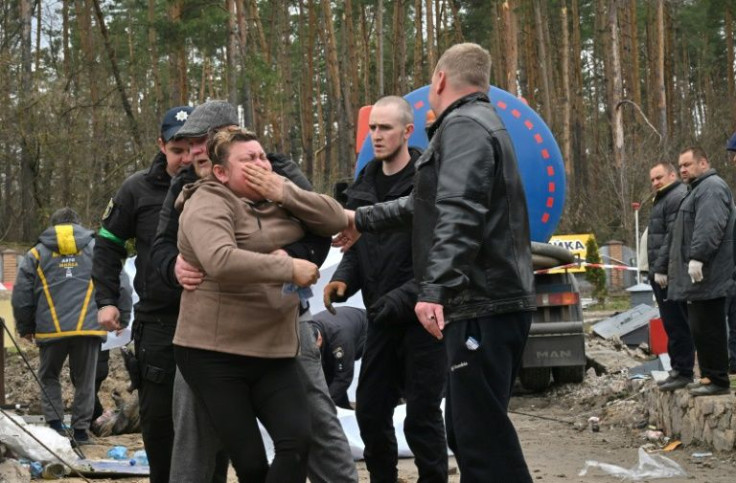 A woman broke down west of Kyiv after peering inside a manhole and recognising the body of her son