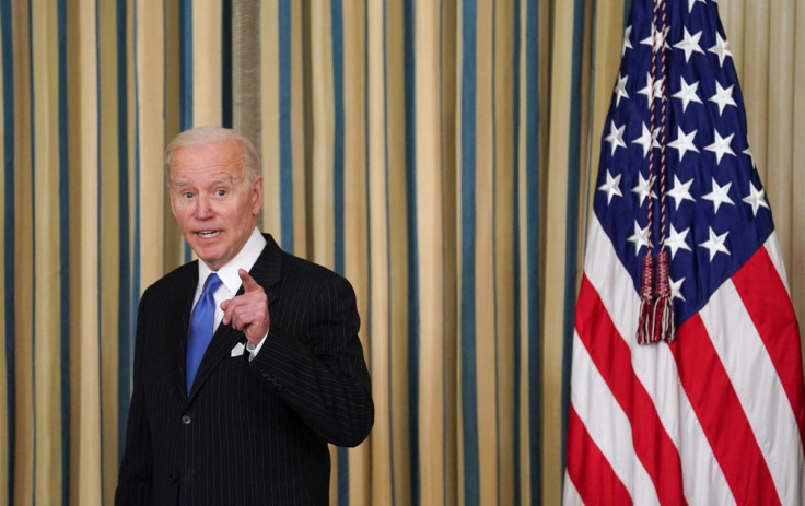 U.S. President Joe Biden answers a question after signing into law H.R. 3076, the "Postal Service Reform Act of 2022" at the White House in Washington, U.S., April 6, 2022. 