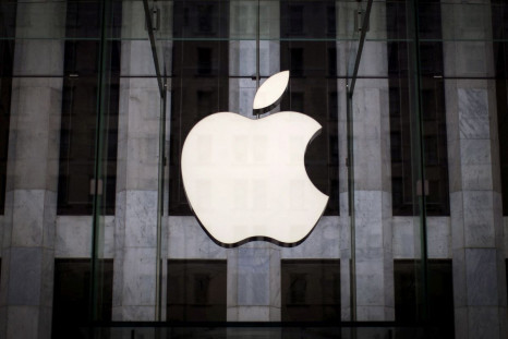 An Apple logo hangs above the entrance to the Apple store on 5th Avenue in the Manhattan borough of New York City, July 21, 2015. 