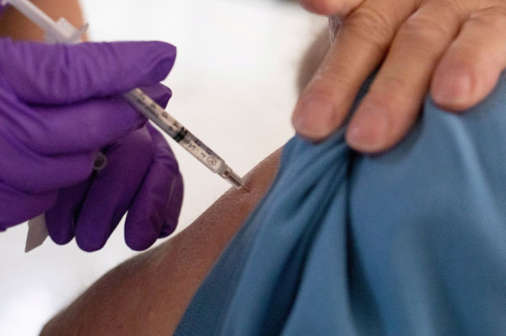 A 50-year-old and immunocompromised resident receives a second booster shot of the coronavirus disease (COVID-19) vaccine in Waterford, Michigan, U.S., April 8, 2022.  