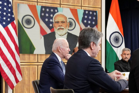 U.S. President Joe Biden, seated with U.S. Secretary of State Antony Blinken and India's Foreign Minister Subrahmanyam Jaishankar, holds a videoconference with India's Prime Minister Narendra Modi to discuss Russia's war with Ukraine from the White House 