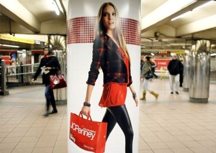People walk past a JC Penney advertisement in a subway station in Manhattan New York 